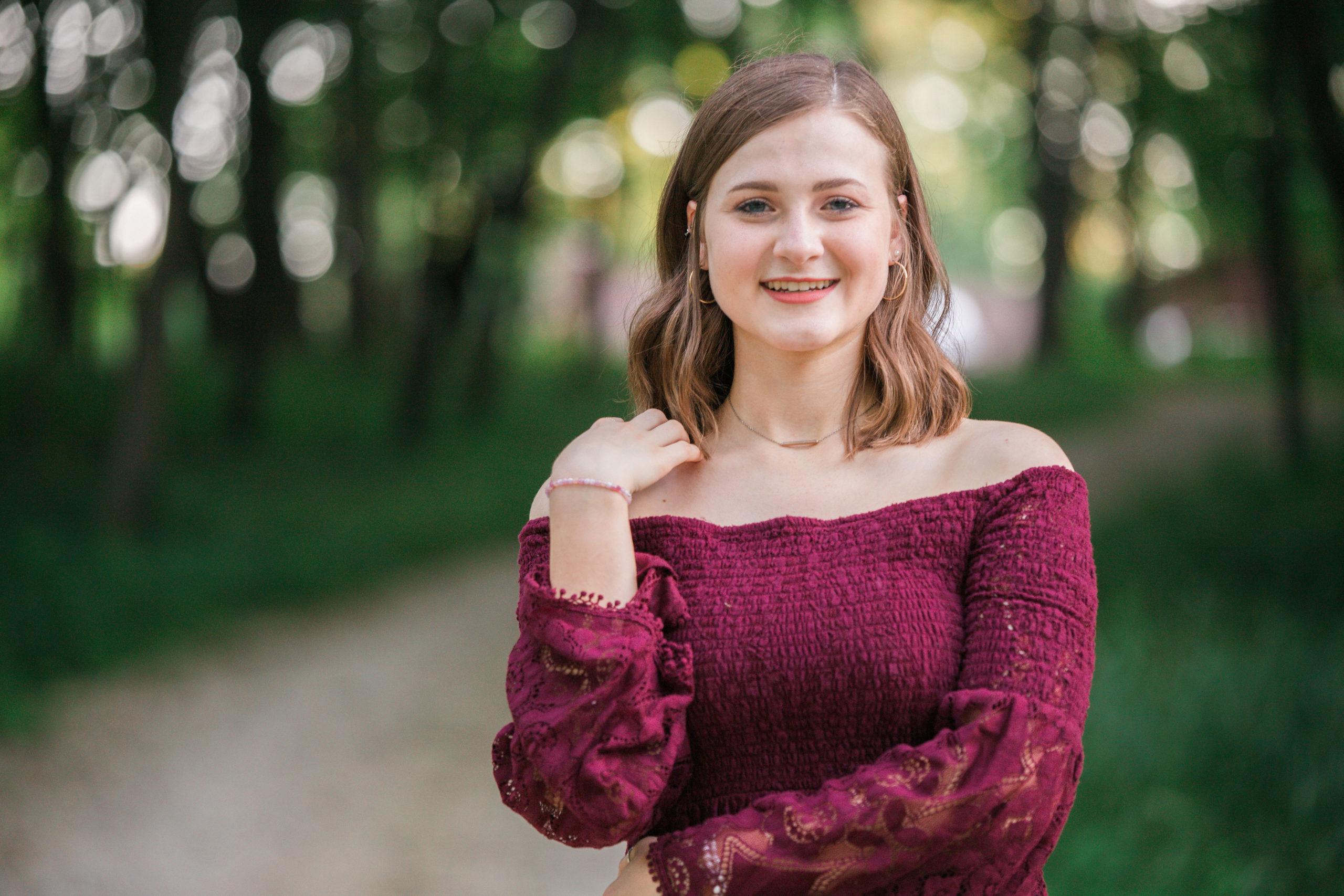 Anamosa Senior smiling in forrest | Anamosa Senior Photography