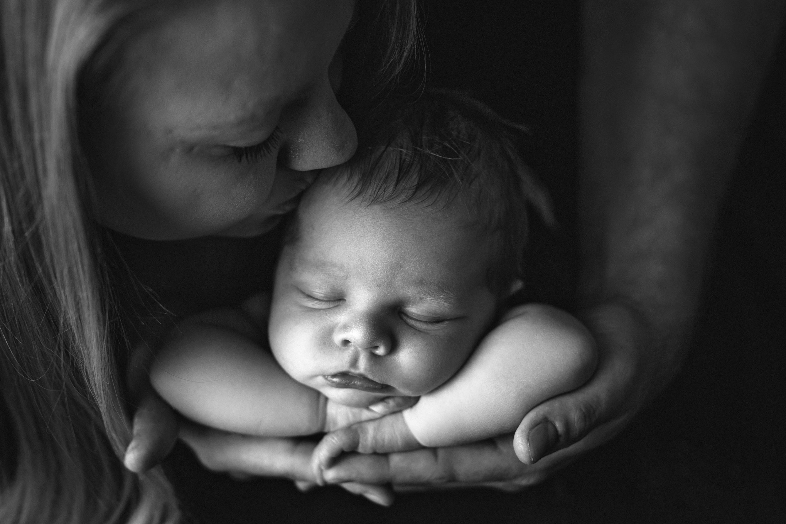 Sleepy Newborn Baby Gets Kissed by Mom | Palo Newborn Photographer | Palo Baby Photoshoot