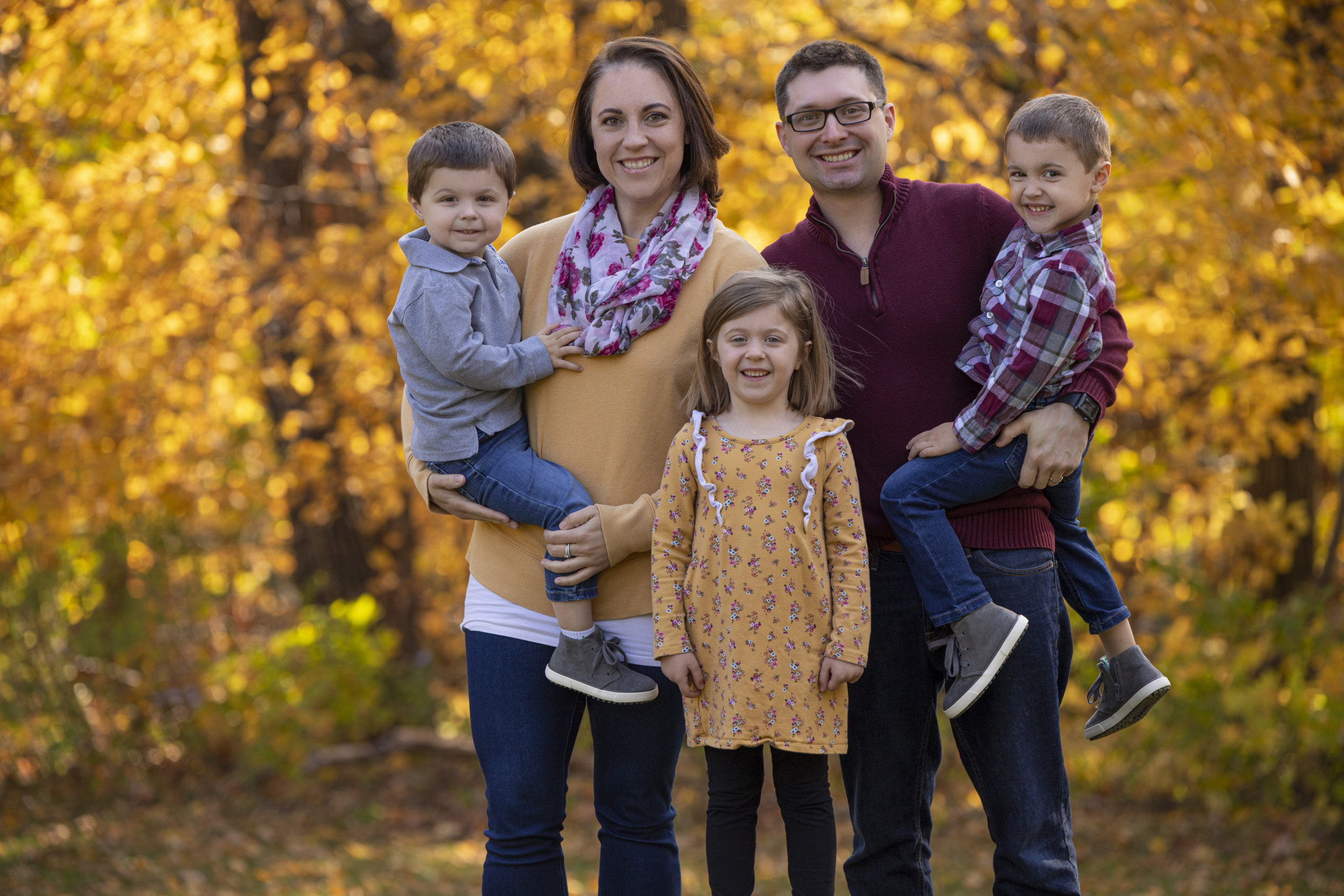 A family of five is shown in Coralville, Iowa. Photographer Ali Kerr Photography